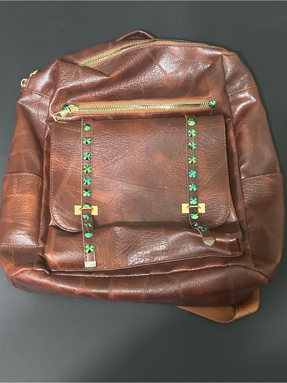Woman’s Brown Faux Leather Backpack with Green Stud Accents